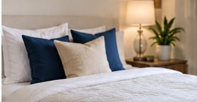 A made bed in a clean bedroom